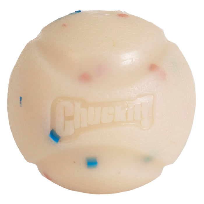 The Chuckit! Birthday Fetch Ball Medium by Chuckit! is a durable white natural rubber dog ball with textured grooves, small colored specks, and the raised Chuckit! logo on its surface.