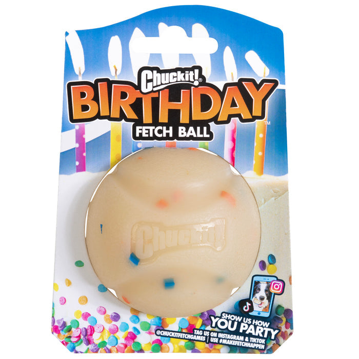 The Chuckit! Birthday Fetch Ball Medium by Chuckit! comes in colorful confetti-themed packaging with birthday candles in the background. This durable, cream-colored ball with multicolored specks is perfect for pups’ playful celebrations.