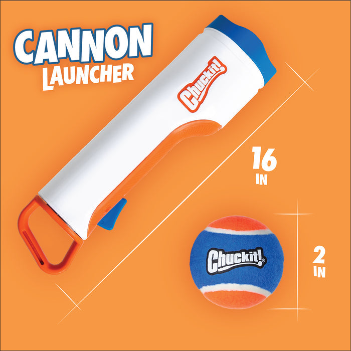 A white and orange Chuckit! Cannon & Cannon Max Dog Ball Launcher by Chuckit! sits beside a blue, orange, and white ball (2-in. diameter). Text notes the launcher’s 16-inch length on an orange background.