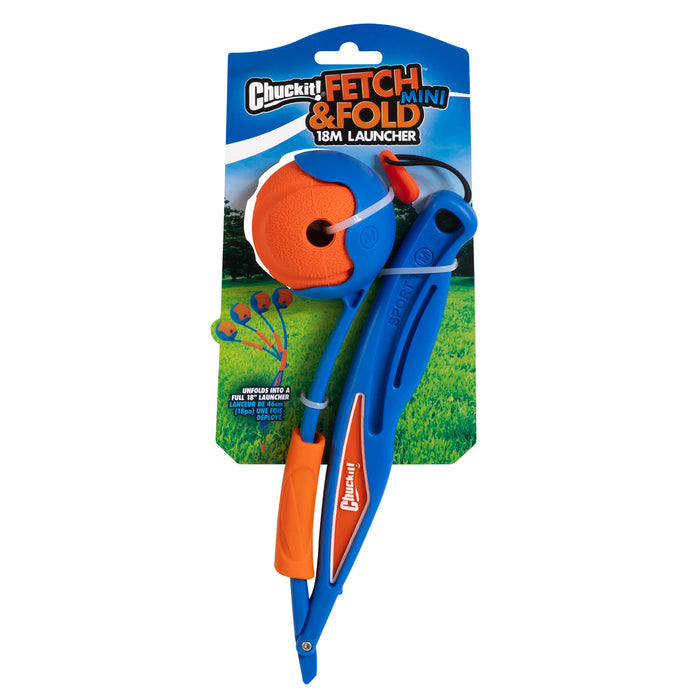 The Chuckit! Fetch & Fold Mini 18M Launcher by Chuckit!, in blue and orange, comes with a matching orange ball and is shown on grassy outdoor-themed packaging—a portable toy ideal for active dogs on the go.