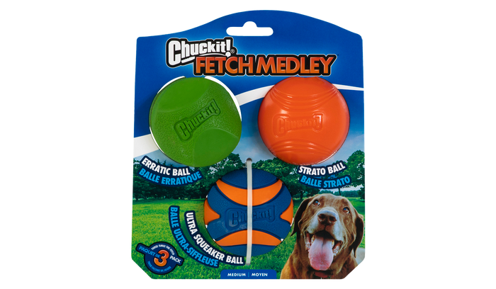 Packaging for Chuckit! Fetch Medley 2 by Chuckit! features three colorful natural rubber fetch balls (green, orange, blue-orange) and a photo of a happy brown dog, highlighting ball variety for medium-sized dogs.