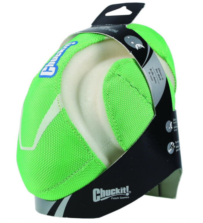 The Chuckit! Fumble Fetch Max Glow is a bright green and beige dog football toy with a textured surface, durable design, and glow-in-the-dark features for high-visibility fetch fun. Packaged and made by Chuckit!.