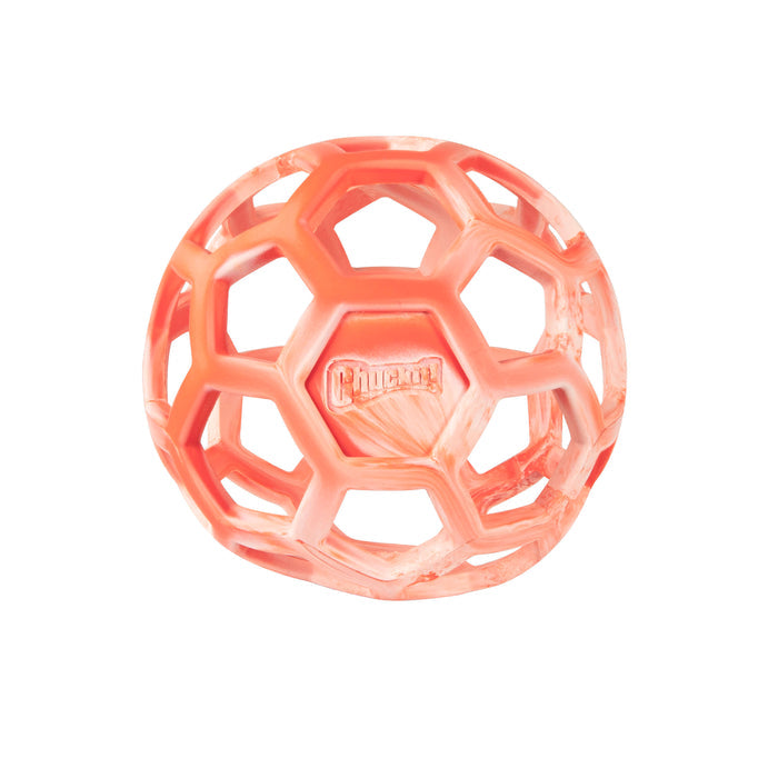 The Chuckit! Hol-ee Roller is a translucent orange rubber dog fetch toy with a hexagonal open lattice design and the Chuckit! logo embossed on one side, shown against a white background.