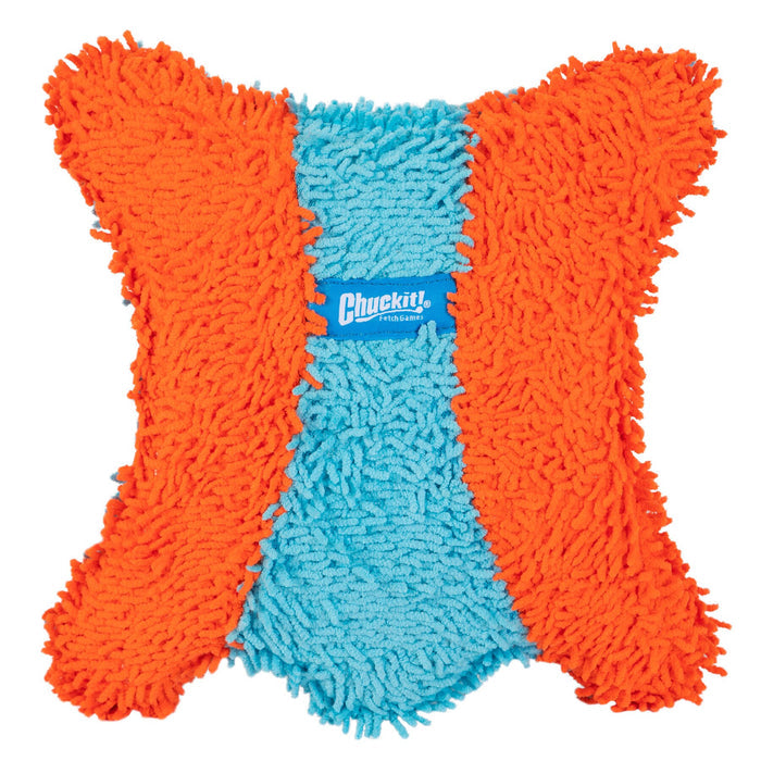 The Chuckit! Indoor Flying Squirrel is a square, shaggy dog toy with two orange sides, a blue center stripe, and the Chuckit! logo label. Its irregular fluffy edges make it perfect for interactive indoor fetch with small dogs.