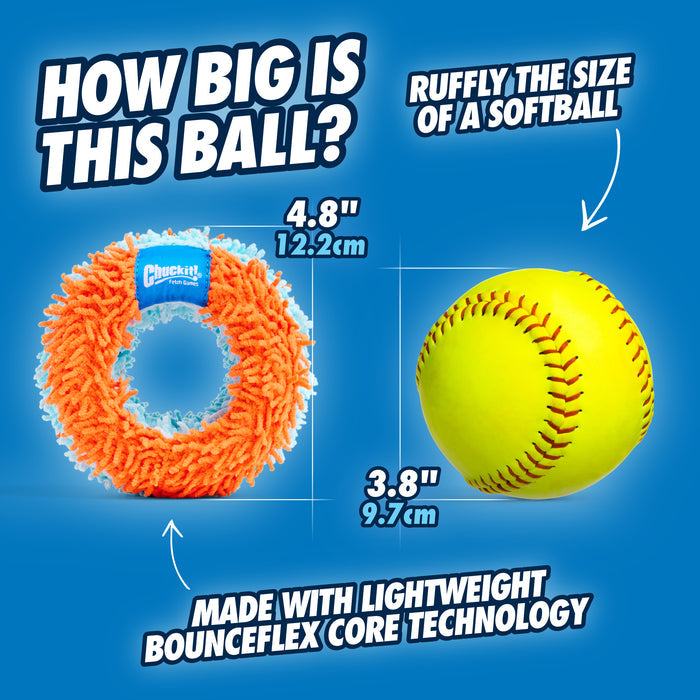 A side-by-side image shows the orange Chuckit! Indoor Roller Dog Toy (Chuckit!, 4.8" x 12.2 cm) next to a yellow softball (3.8" x 9.7 cm), highlighting their similar sizes and Bounceflex Core for a soft, indoor dog toy experience.