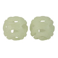 Two pale, translucent Chuckit! Max Glow Air Fetch Balls with an open lattice design sit side by side on a white background, showing the perfect breathable dog toy from Chuckit!.