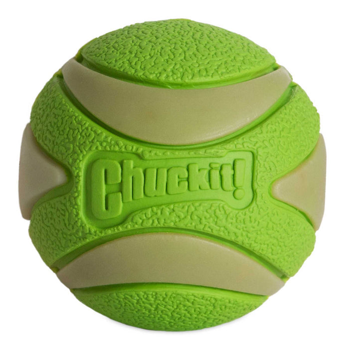 The Chuckit! Max Glow Ultra Squeaker Ball by Chuckit! is a bright green glow-in-the-dark fetch toy for dogs, featuring both textured and smooth curved sections plus the Chuckit! brand name embossed on its surface.