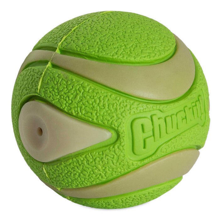 The Chuckit! Max Glow Ultra Squeaker Ball by Chuckit! is a green and beige rubber dog fetch toy that glows in the dark and features an embossed logo on its textured surface.