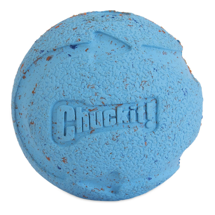 A used, textured blue rubber ball from the Chuckit! Medium Fetch Medley Dog Ball Set, featuring the Chuckit! logo embossed and visible dirt.