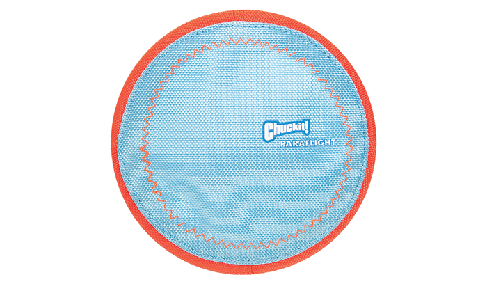 The Chuckit! Paraflight Flyer Dog Toy by Chuckit! is a blue fabric disc with an orange border and zigzag stitching, made for playing fetch and also floats for fun in the water.