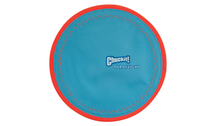 The Chuckit! Paraflight Flyer Dog Toy is a durable blue frisbee with a red rim and white Chuckit! branding at the center, designed to float—ideal for active fetch games with your dog.