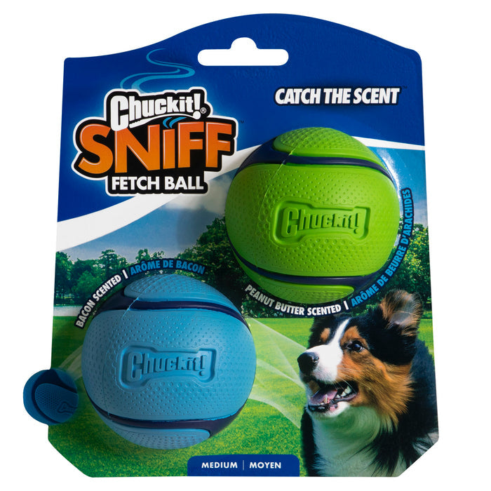 The Chuckit! Sniff Fetch Ball Duo by Chuckit! includes medium blue (bacon scented) and green (peanut butter scented) durable rubber balls. Package features a dog photo, "Catch the Scent" text, and is labeled medium size.