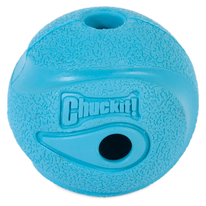 The Chuckit! The Whistler Dog Toy by Chuckit! is a textured blue rubber ball with two holes and an embossed logo, designed to make fetch fun and engaging for dogs with its high bounce.