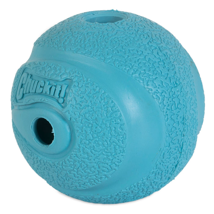 The Chuckit! The Whistler Dog Toy by Chuckit! is a durable blue rubber fetch ball with two holes, embossed with "Chuckit!" on one side, and designed to bounce high and keep dogs engaged during play.