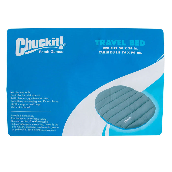 Blue and white packaging for the Chuckit! Travel Pillow Bed features the Chuckit! logo, product name, bed dimensions (30 x 39 in/76 x 99 cm), and an image of the round, padded gray portable dog bed.