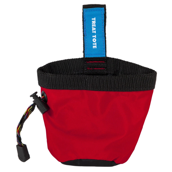 The Chuckit! Treat Tote by Chuckit! is a small red fabric pouch with a black drawstring and blue label, ideal for carrying pet treats during reward-based training.
