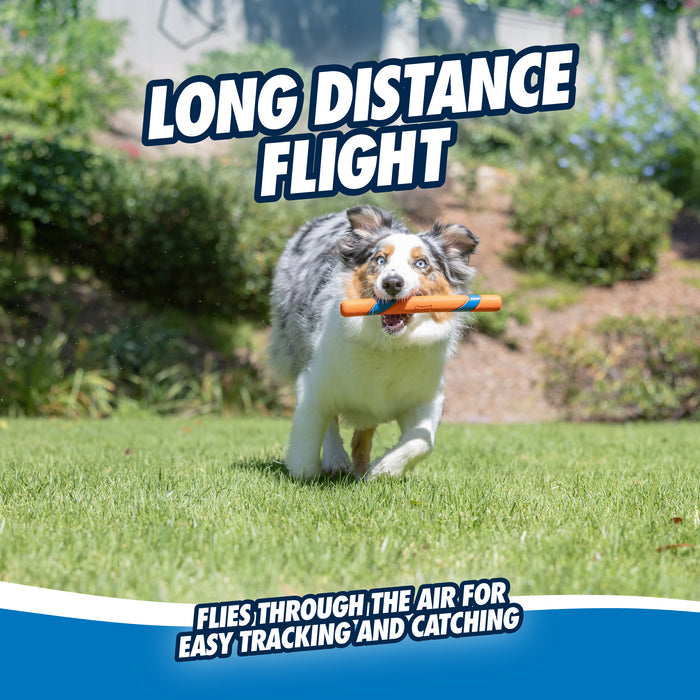 A dog runs on grass with a Chuckit! Ultra Fetch Stick from Chuckit! in its mouth. Above, bold text reads LONG DISTANCE FLIGHT. Below, smaller text says, This durable fetch toy flies far for easy tracking and catching.