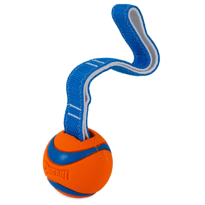 The Chuckit! Ultra Tug Dog Toy is a durable orange rubber ball with blue stripes and a textured surface, featuring a sturdy blue and gray strap for tugging. The Chuckit! logo is embossed, making it perfect for interactive play with your dog.