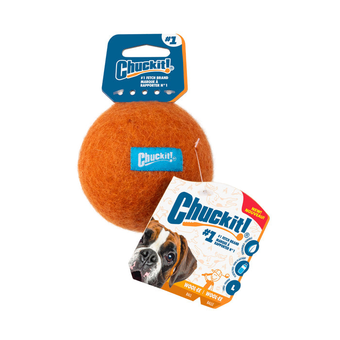 A Chuckit! Wool-ee Ball dog toy with attached labels featuring a brown and white dog, the Chuckit! logo, and tags noting it’s eco-friendly, the #1 fetch brand, and suitable for large dogs.