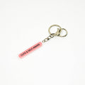Keychain with 'Cute & Self Aware' tag on a white background