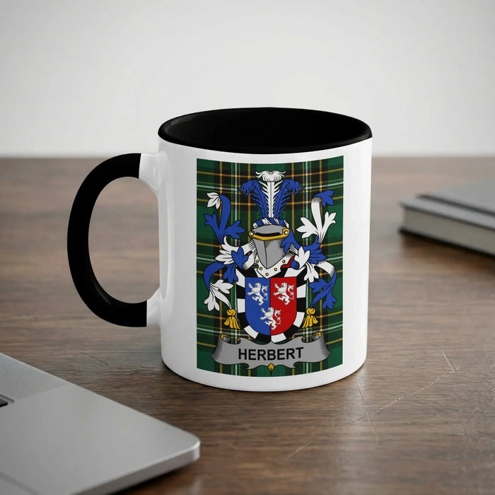 White mug with black trim displaying the Herbert family crest.