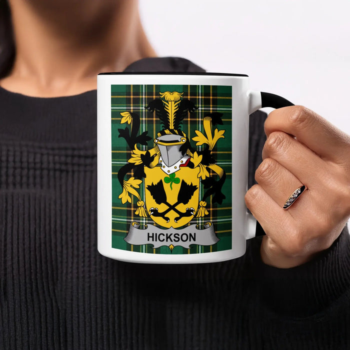 Mug with the Hickson family crest on a plaid background.