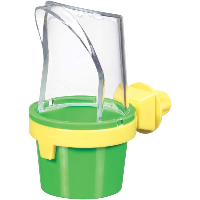 The JW Pet JW Clean Cup Bird Feed & Water Cup is a green and yellow plastic feeder with a transparent cover and an attachment for securing to a cage.