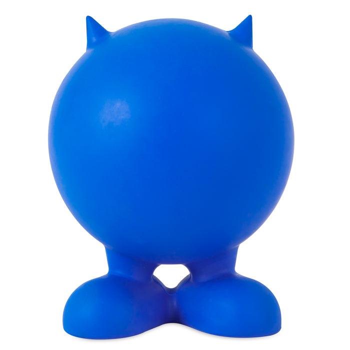 The JW Cuz Dog Toy by JW Pet is a blue, round, cartoonish figure made from natural rubber with two large feet and small pointed ears, resembling a quirky dog toy against a white background.