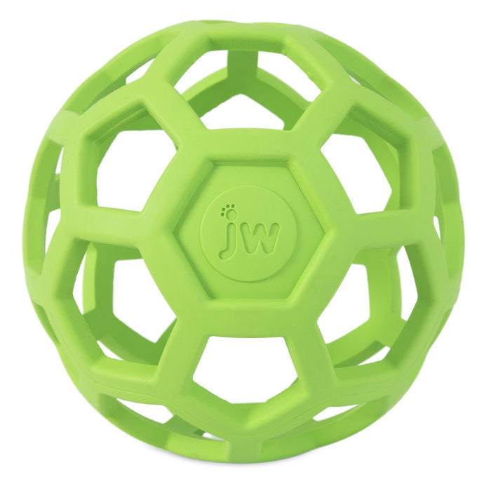 The JW Hol-ee Roller Dog Toy by JW Pet is a green, hollow natural rubber toy with hexagonal and pentagonal cut-outs and "jw" embossed in the center, designed as an engaging puzzle toy for dogs.