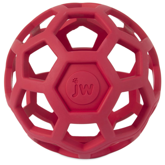 The JW Hol-ee Roller Dog Toy by JW Pet is a red natural rubber toy featuring a hexagonal open lattice design with "jw" embossed in the center.