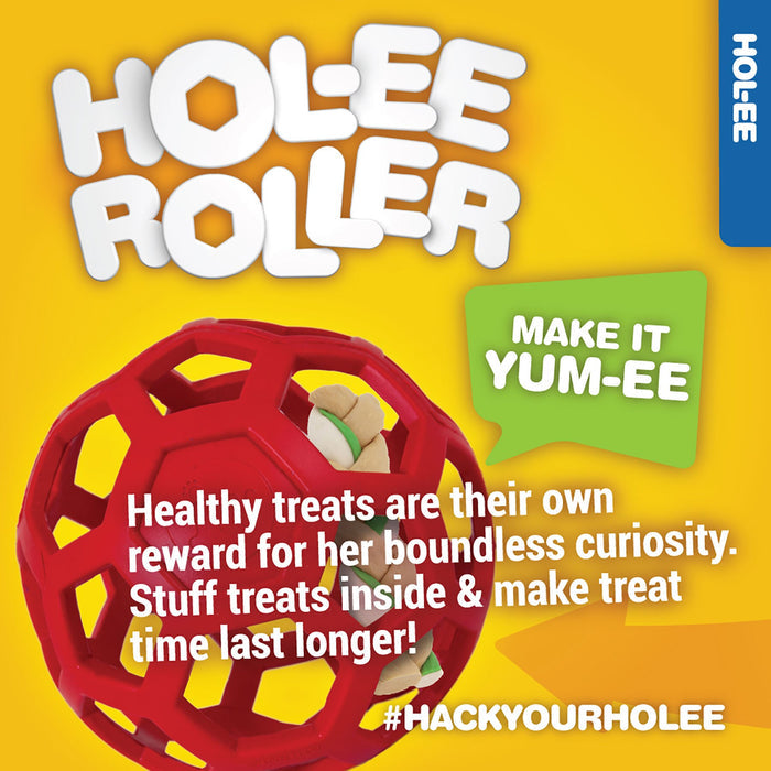 A red JW Hol-ee Roller Dog Toy by JW Pet is displayed on a yellow background. Text: Make it yum-ee. Stuff treats inside for healthy, lasting fun that rewards your curious pup! #HackYourHolee.