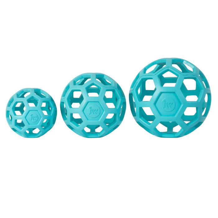 Three turquoise JW Hol-EE Roller Trend-EE dog puzzle toys by JW Pet, each a different size with hexagon patterns, are lined up side by side on a white background. Each provides mental stimulation and features "jw" embossed at the center.