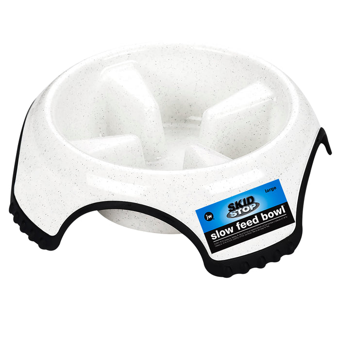 The JW Pet Skid Stop Slow Feed Bowl is a white dog bowl with raised sections to slow eating and black non-slip edges, labeled SKID STOP on the side.