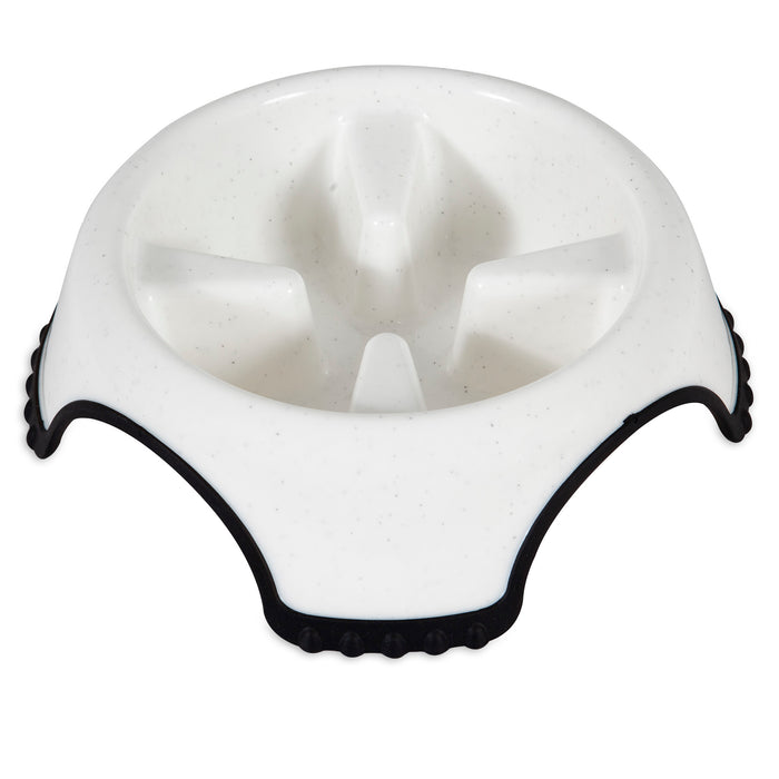The JW Skid Stop Slow Feed Bowl by JW Pet is a white plastic bowl with raised ridges to slow your dog's eating and black non-slip rubber grips for a secure, skid-free base.