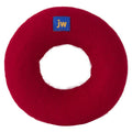 The JW Wool-ee Ring Dog Toy by JW Pet is a round, red felt ring with a small blue "jw" patch on top. Its hollow center and soft, fuzzy surface make it an eco-friendly and fun toy for your pup.