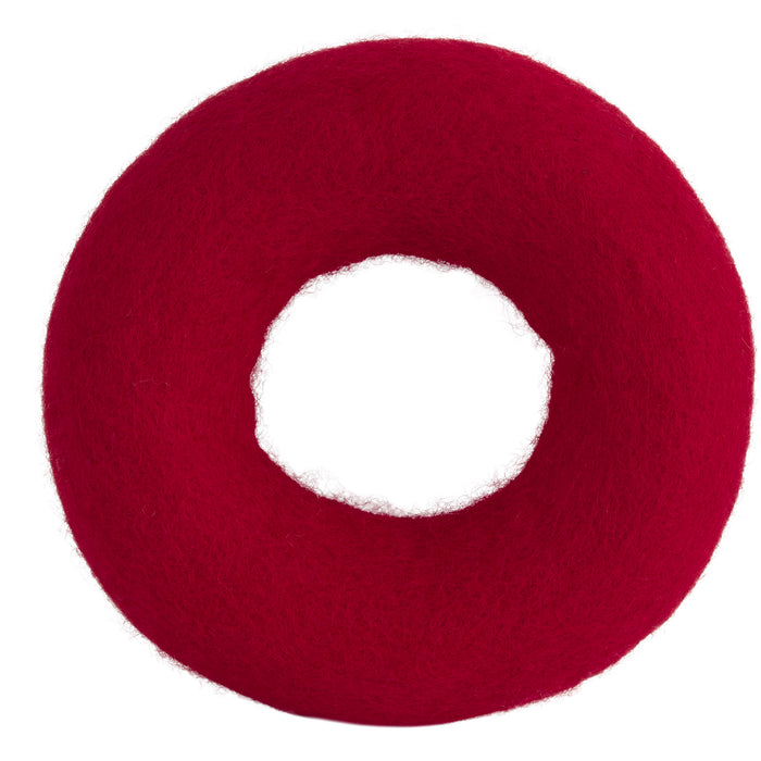 The JW Pet JW Wool-ee Ring Dog Toy is a bright red, fuzzy, donut-shaped toy with a large central hole, handmade and shown on a white background.