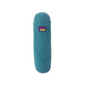 A blue, cylindrical cat toy with a fuzzy texture made from natural wool, featuring a small purple and green Mad Cat label near the top is the Mad Cat Wacky Wool Crinkle Kicker.
