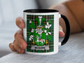 McGuire family crest Irish heritage mug, white ceramic with black handle on tartan