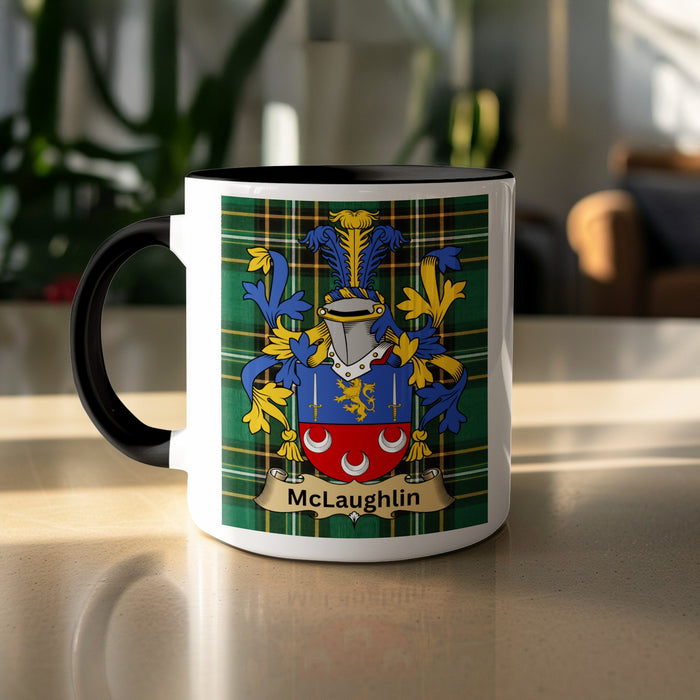 Black-accent McLaughlin heritage mug on a sunlit table, showing the shield on a tartan background.
