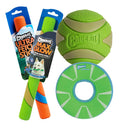 The Chuckit! Night Chase Pro Bundle (Glow in the Dark Bundle) includes two orange-and-green fetch sticks, a large green-and-tan textured rubber ball, and a green-and-blue frisbee with a hole—perfect for fetch or night play.