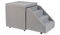 The PetFusion Multi-Purpose Pet Stairs, in premium gray with three steps and a textured fabric for durability, sits beside a soft cube-shaped ottoman, allowing pets to access higher surfaces safely.