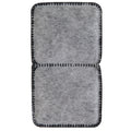The Petmate Fresh Flow Replacement Charcoal Filter by Petmate is a rectangular, gray, felt-like filter with two sections and black, stitched edges featuring a grid pattern. Its soft, fibrous texture resembles charcoal filters and is ideal as replacement filters for pet water fountains.