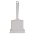 The Petmate Handy Stand Litter Scoop by Petmate is a white plastic scoop with a long handle and wide flat base for effective debris collection. A convenient hole in the handle allows for easy hanging and sanitary storage, helping maintain tidiness.