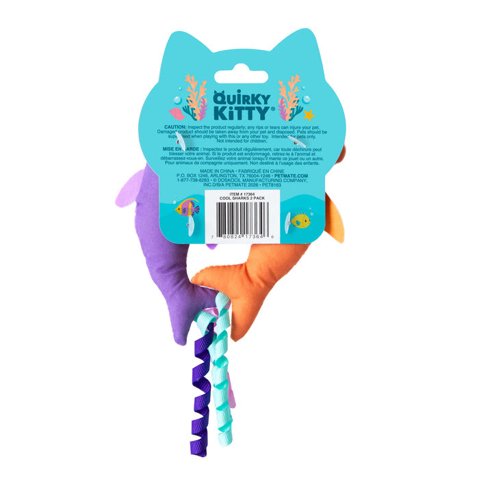 The Quirky Kitty Color Changing Shark 2pk are interactive, ocean-themed catnip toys featuring colorful sections, ribbon-like tails, and underwater graphics on the blue Quirky Kitty tag with product info.