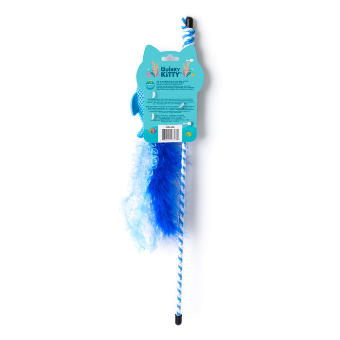 The Quirky Kitty Cool Shark Wand is a blue interactive cooling cat toy with catnip, featuring a fluffy feather and ruffled ribbon. It’s packaged in a cat-head shaped box with product details and playful graphics from Quirky Kitty.