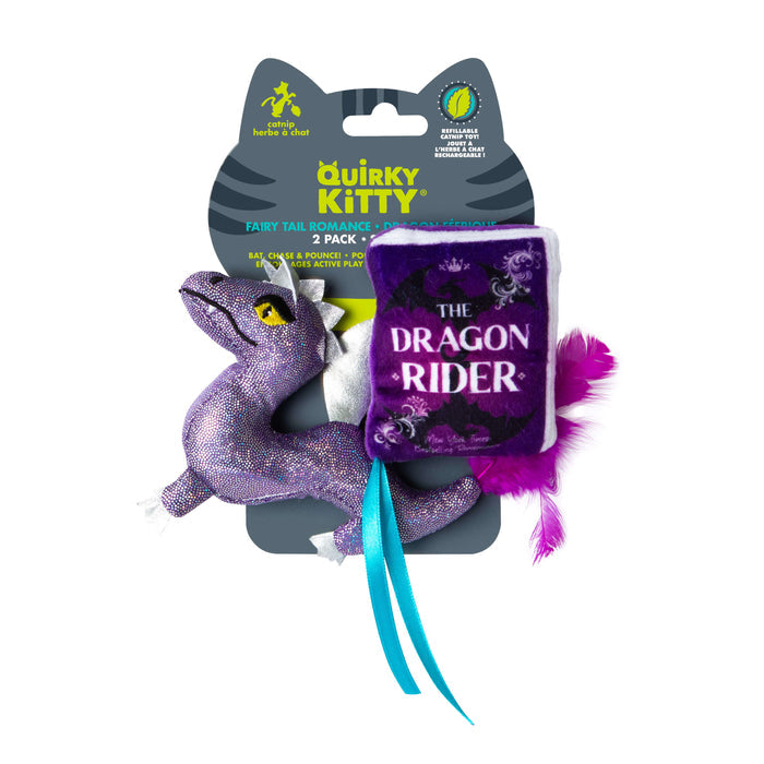 The Quirky Kitty Fairy Tail Romance 2pk Cat Toy Set with Catnip includes a sparkly purple dragon plush and a plush book labeled The Dragon Rider, both with purple feathers and blue ribbons. Brand: Quirky Kitty.