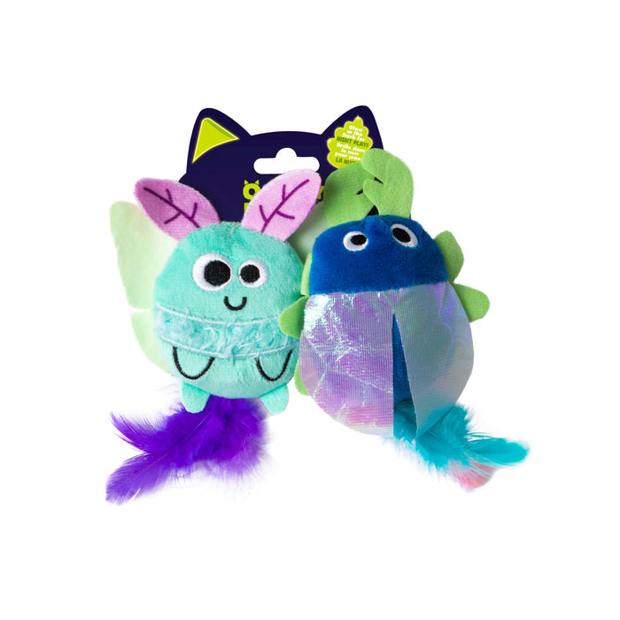 The Quirky Kitty Luna Bugs 2pk are forest-inspired, glow-in-the-dark cat toys with catnip and silvervine—one shaped like a teal butterfly with purple wings, the other a blue eggplant with green leaves—both on a cat ear-topped card.