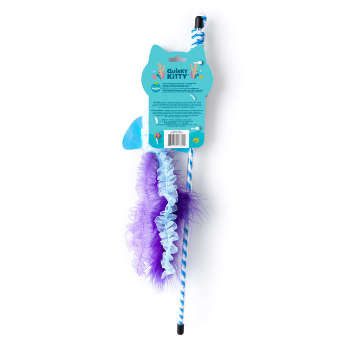 The Quirky Kitty Manta Ray Wand is an interactive cat wand toy with catnip, featuring blue and white stripes, purple ruffled fabric, attached feathers, and playful packaging with a cat-shaped top and colorful graphics.
