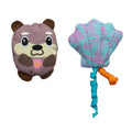 The Quirky Kitty Otterly Cool 2-Pack includes a smiling brown otter toy with a pink seashell and an ocean-themed pastel blue and purple seashell toy with ribbon streamers, both cooling cat toys with catnip.