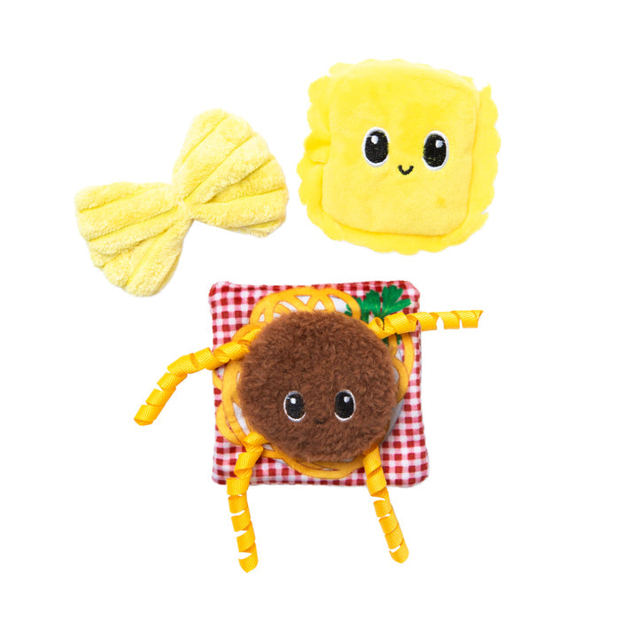 The Quirky Kitty Pasta Pals 3-Pack Cat Toy Set with Catnip features three whimsical pasta-shaped plush toys—bowtie, ravioli, and spaghetti—each with cute faces, perfect for playful cats. From Quirky Kitty.